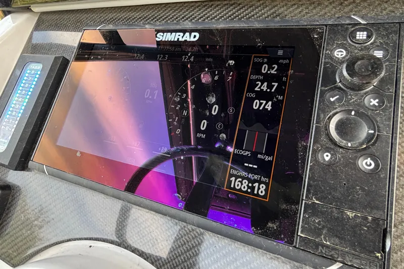  Yacht Photos Pics Simrad navigation display on 2022 Fountain 38 SC boat, showing speed, depth, and engine hours.