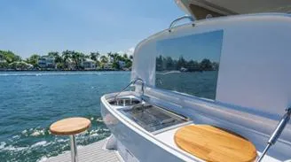 Custom Order You 375 Today! Yacht Photos Pics 2025 Hanover 375 Inboard yacht with outdoor kitchen, cruising on a sunny day.