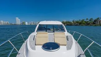 Custom Order You 375 Today! Yacht Photos Pics 2025 Hanover 375 Inboard yacht cruising on a sunny day with city skyline in background.