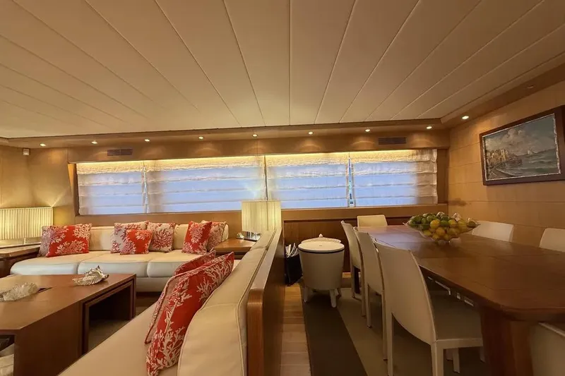  Yacht Photos Pics Luxurious interior of 2009 Maiora 27 yacht with elegant seating and dining area.