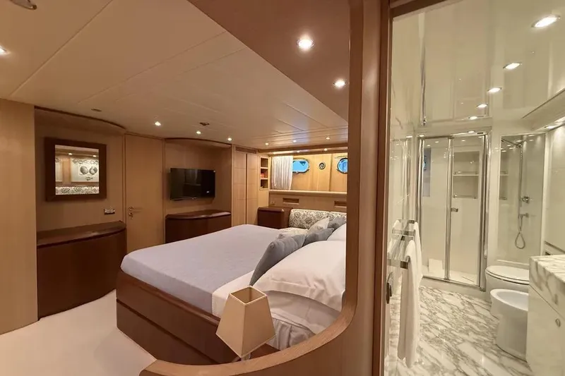  Yacht Photos Pics Luxurious Maiora 27 yacht bedroom with ensuite bathroom, featuring elegant wood finishes, 2009 model.