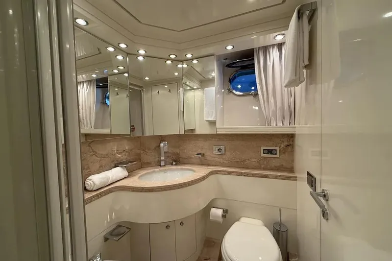  Yacht Photos Pics Luxurious bathroom in 2009 Maiora 27 yacht with elegant fixtures and marble countertop.