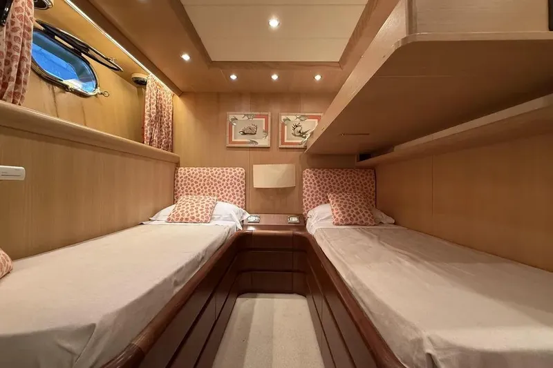  Yacht Photos Pics Luxurious twin cabin interior of 2009 Maiora 27 yacht with elegant decor.