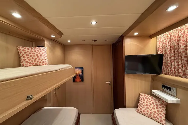  Yacht Photos Pics Luxurious 2009 Maiora 27 yacht cabin with bunk beds and modern amenities.