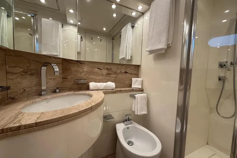  Yacht Photos Pics Luxurious bathroom on 2009 Maiora 27 yacht with marble sink, bidet, and shower.
