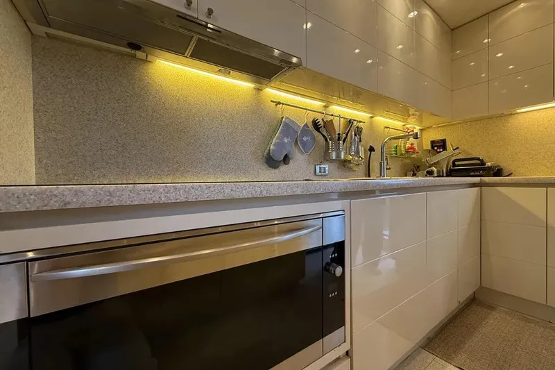  Yacht Photos Pics Modern kitchen in 2009 Maiora 27 yacht with sleek cabinets and under-cabinet lighting.