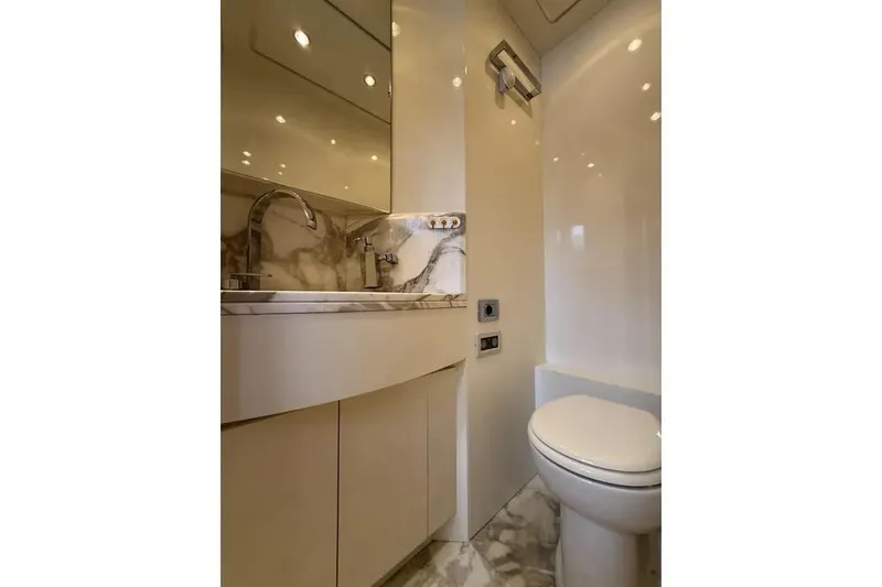  Yacht Photos Pics Luxurious bathroom in 2009 Maiora 27 yacht with marble accents and modern fixtures.