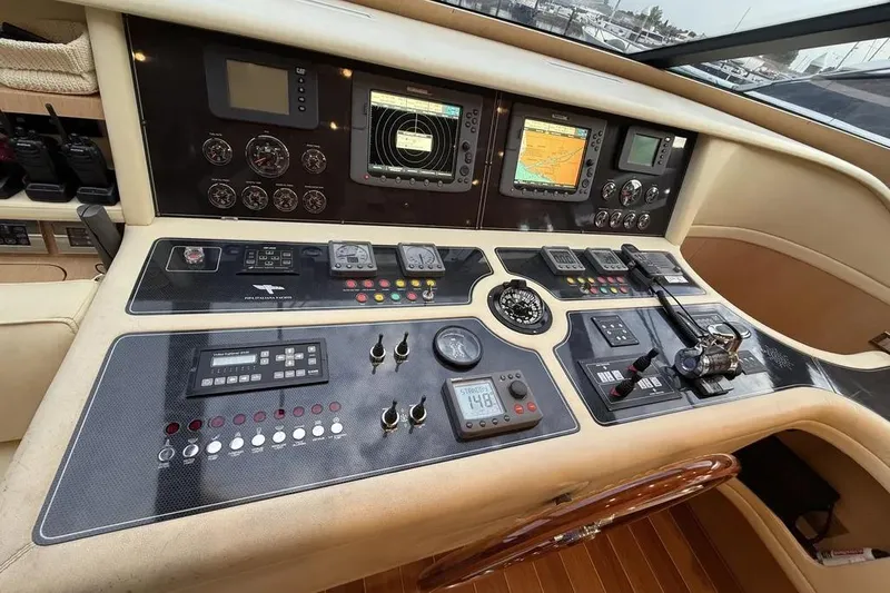  Yacht Photos Pics Control panel of a 2009 Maiora 27 yacht with navigation instruments and gauges.