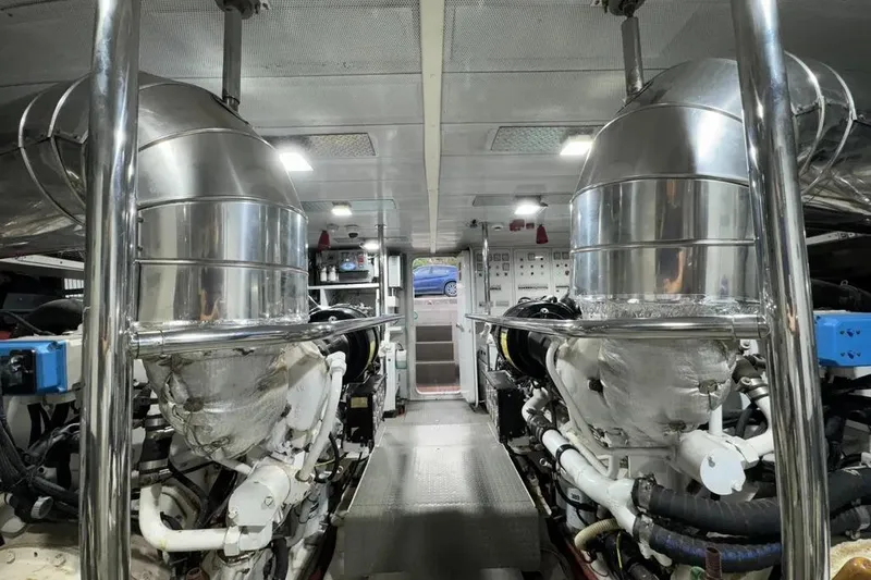  Yacht Photos Pics Engine room of 2009 Maiora 27 yacht, featuring dual engines and metallic components.