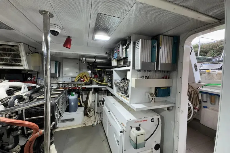  Yacht Photos Pics Engine room of 2009 Maiora 27 yacht, featuring Cummins Onan generator and organized equipment.