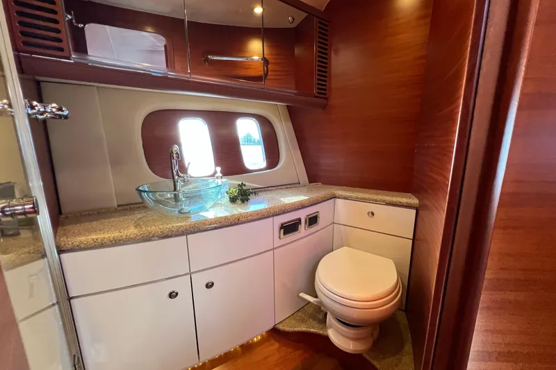 La Koko Yacht Photos Pics Luxurious 2012 Zeelander Z44 yacht bathroom with elegant wood finish and modern fixtures.