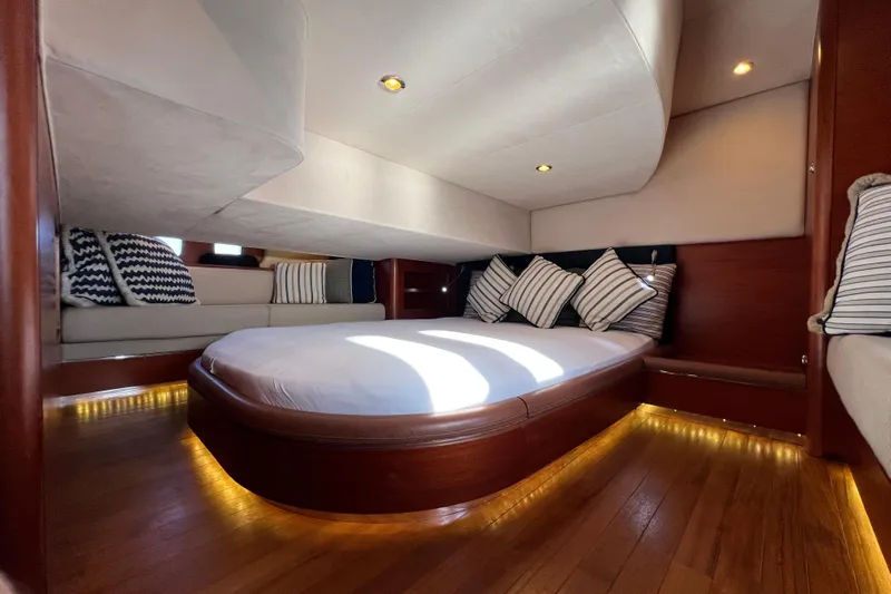 La Koko Yacht Photos Pics Luxurious 2012 Zeelander Z44 yacht cabin with elegant wood finish and cozy bedding.