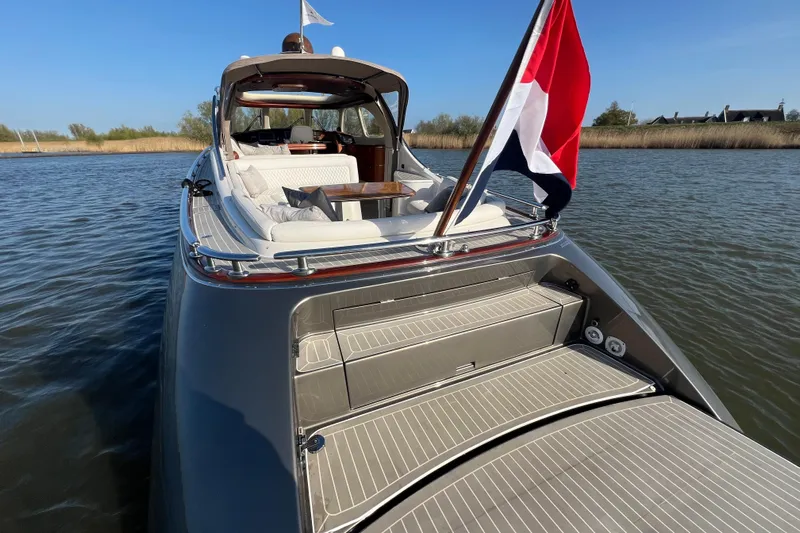 La Koko Yacht Photos Pics Luxurious 2012 Zeelander Z44 yacht with elegant deck and flag on calm water.