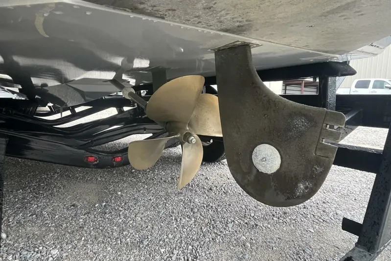  Yacht Photos Pics 2022 Nautique Super Air Nautique G23 propeller and rudder on trailer.