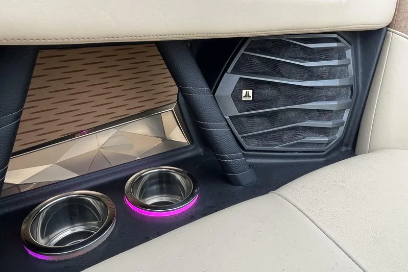  Yacht Photos Pics 2022 Nautique Super Air G23 interior with speaker and illuminated cup holders.