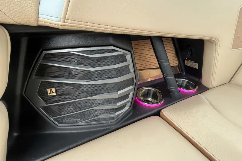  Yacht Photos Pics 2022 Nautique Super Air G23 interior with speaker and illuminated cup holders.