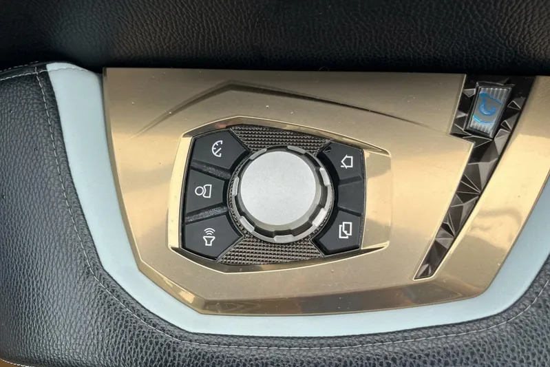  Yacht Photos Pics Control panel of 2022 Nautique Super Air Nautique G23 boat, featuring various function buttons.