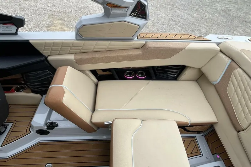  Yacht Photos Pics 2022 Nautique Super Air Nautique G23 interior with beige and brown seating.