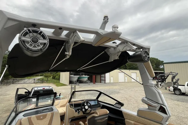  Yacht Photos Pics 2022 Nautique Super Air Nautique G23 boat with advanced sound system and sleek interior design.