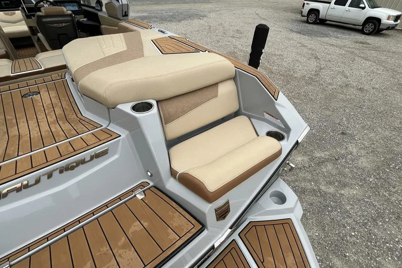  Yacht Photos Pics 2022 Nautique Super Air G23 boat with beige seating and teak flooring.