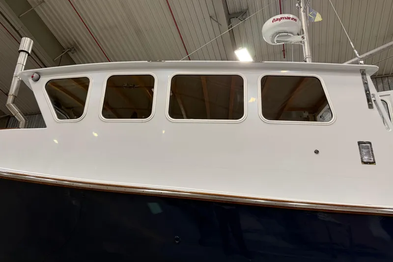 Chad-m Yacht Photos Pics 2022 Covey Island 38 Lobster Yacht in a boatyard, side view.