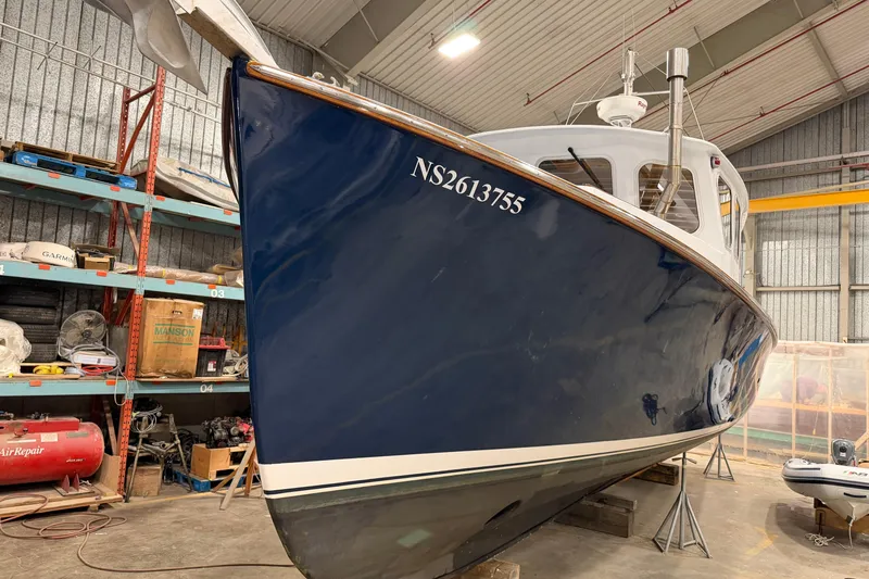 Chad-m Yacht Photos Pics 2022 Covey Island 38 Lobster Yacht in a workshop, blue hull, registration NS2613755.