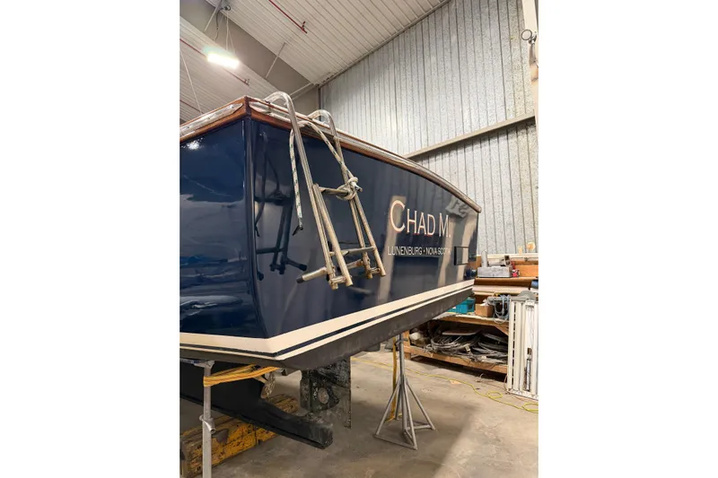Chad-m Yacht Photos Pics 2022 Covey Island 38 Lobster Yacht in a workshop, rear view with ladder.