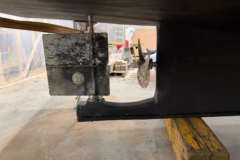 Chad-m Yacht Photos Pics 2022 Covey Island 38 Lobster Yacht propeller and rudder in a workshop setting.