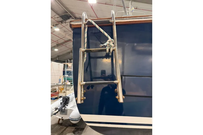 Chad-m Yacht Photos Pics Covey Island 38 Lobster Yacht 2022 with metal ladder in a boatyard.