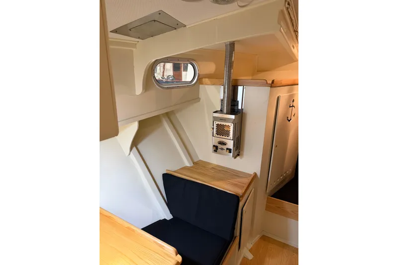 Chad-m Yacht Photos Pics Interior of 2022 Covey Island 38 Lobster Yacht with seating and heater.