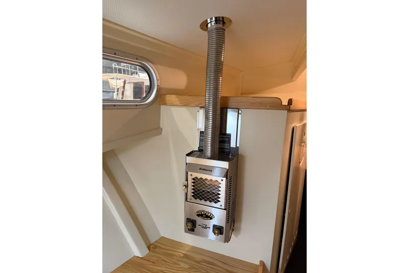 Chad-m Yacht Photos Pics Interior of 2022 Covey Island 38 Lobster Yacht with a compact heater.