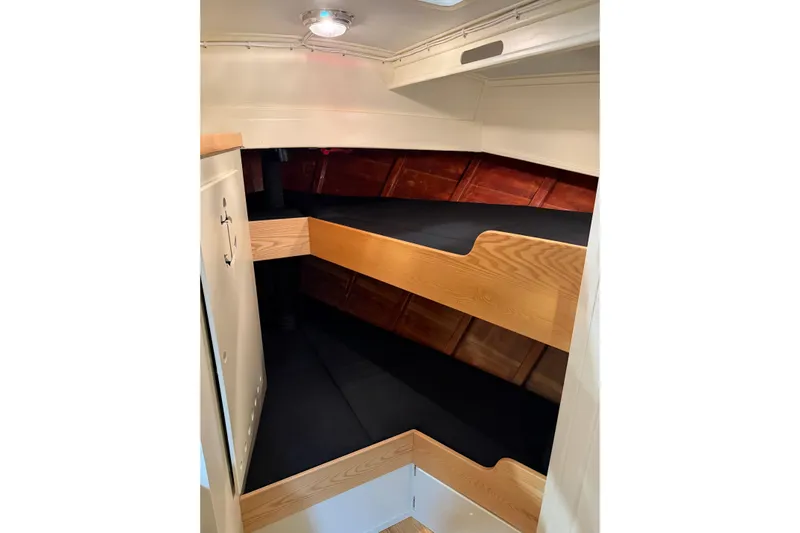 Chad-m Yacht Photos Pics Interior cabin of 2022 Covey Island 38 Lobster Yacht with wooden bunk beds.