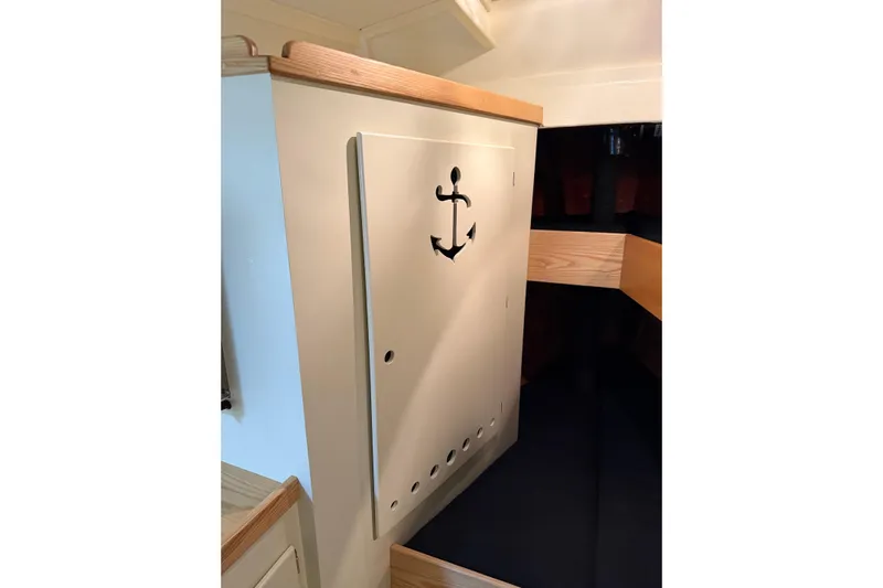 Chad-m Yacht Photos Pics Interior of 2022 Covey Island 38 Lobster Yacht with anchor design on cabinet.