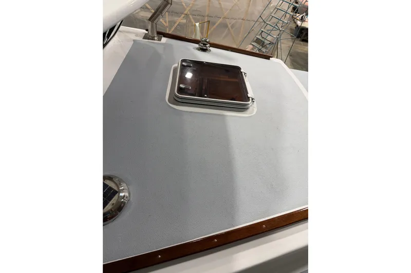 Chad-m Yacht Photos Pics 2022 Covey Island 38 Lobster Yacht deck with hatch and wooden trim.