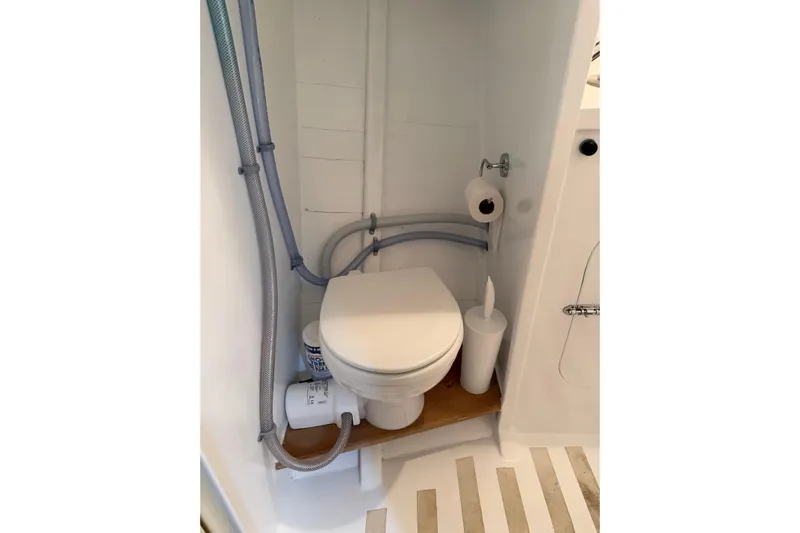 Chad-m Yacht Photos Pics Compact bathroom in 2022 Covey Island 38 Lobster Yacht, featuring a modern toilet setup.