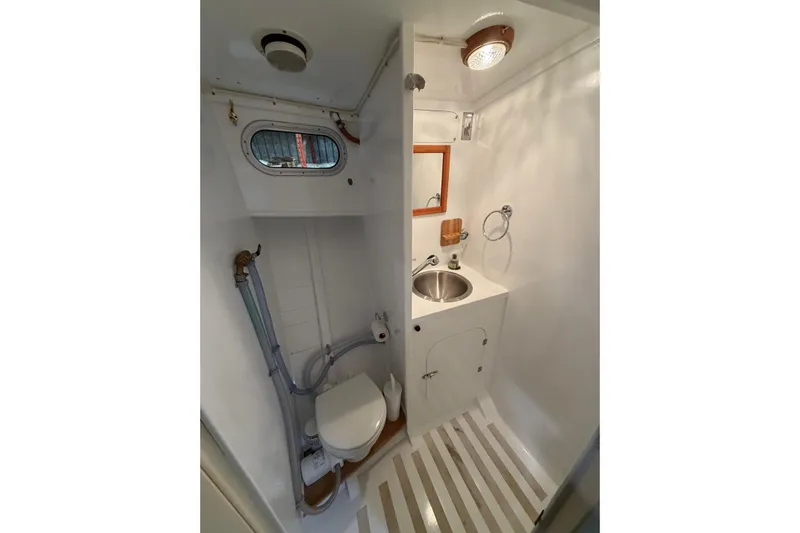 Chad-m Yacht Photos Pics Compact bathroom in 2022 Covey Island 38 Lobster Yacht with sink and toilet.