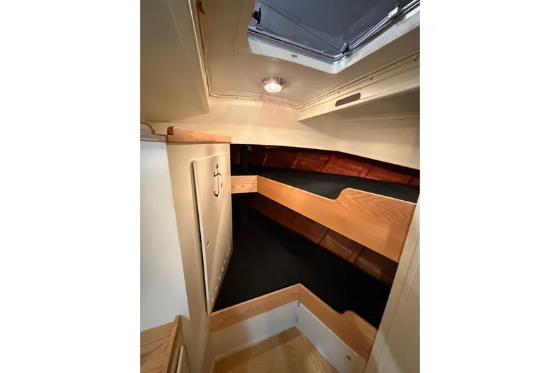 Chad-m Yacht Photos Pics Interior cabin of 2022 Covey Island 38 Lobster Yacht, featuring wooden bunk beds.