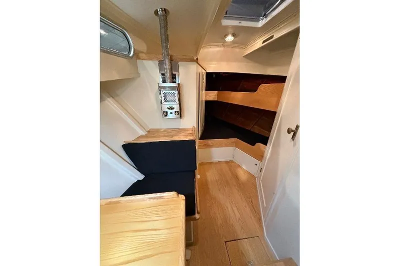 Chad-m Yacht Photos Pics Interior of 2022 Covey Island 38 Lobster Yacht with wood finish and seating.