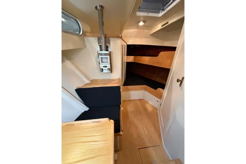 Chad-m Yacht Photos Pics Interior of 2022 Covey Island 38 Lobster Yacht with wooden finish and seating area.