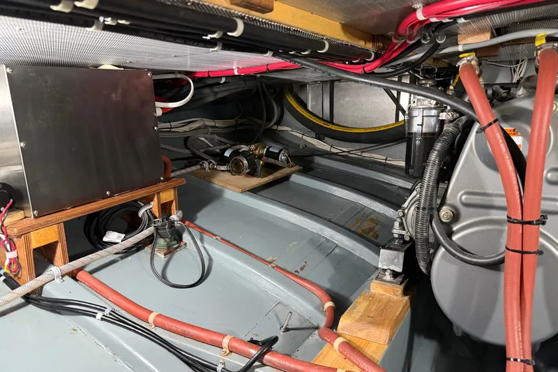 Chad-m Yacht Photos Pics Engine compartment of 2022 Covey Island 38 Lobster Yacht, showcasing wiring and mechanical components.