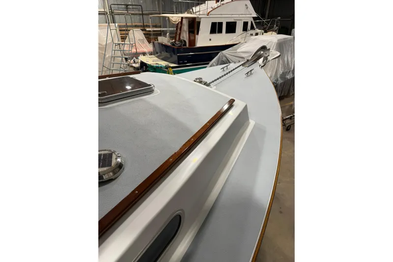 Chad-m Yacht Photos Pics 2022 Covey Island 38 Lobster Yacht in a boatyard, showcasing deck and anchor details.