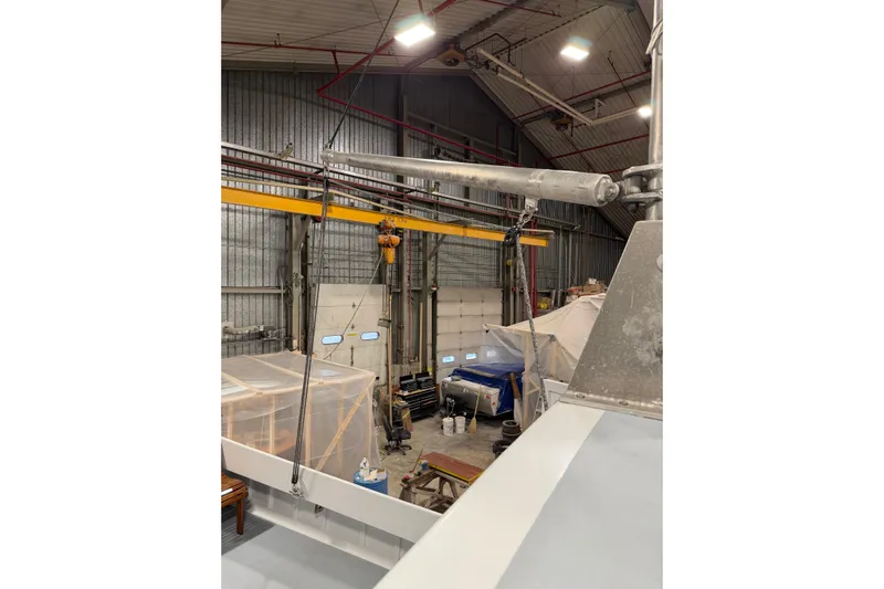 Chad-m Yacht Photos Pics Indoor view of a 2022 Covey Island 38 Lobster Yacht under construction in a workshop.