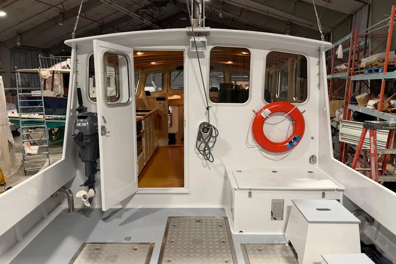 Chad-m Yacht Photos Pics 2022 Covey Island 38 Lobster Yacht interior with open door and life preserver.