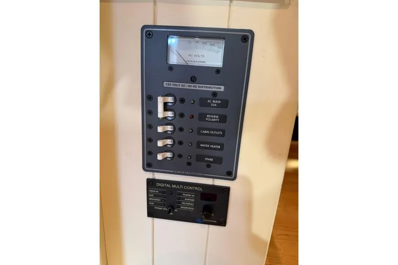 Chad-m Yacht Photos Pics Electrical control panel on 2022 Covey Island 38 Lobster Yacht, featuring AC distribution and digital controls.