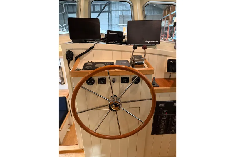 Chad-m Yacht Photos Pics Helm of 2022 Covey Island 38 Lobster Yacht with Raymarine navigation equipment.