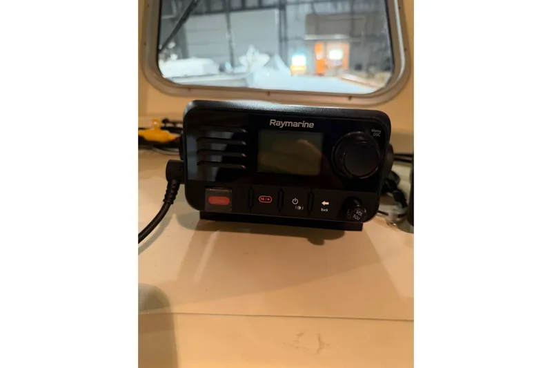 Chad-m Yacht Photos Pics Raymarine marine radio on 2022 Covey Island 38 Lobster Yacht dashboard.