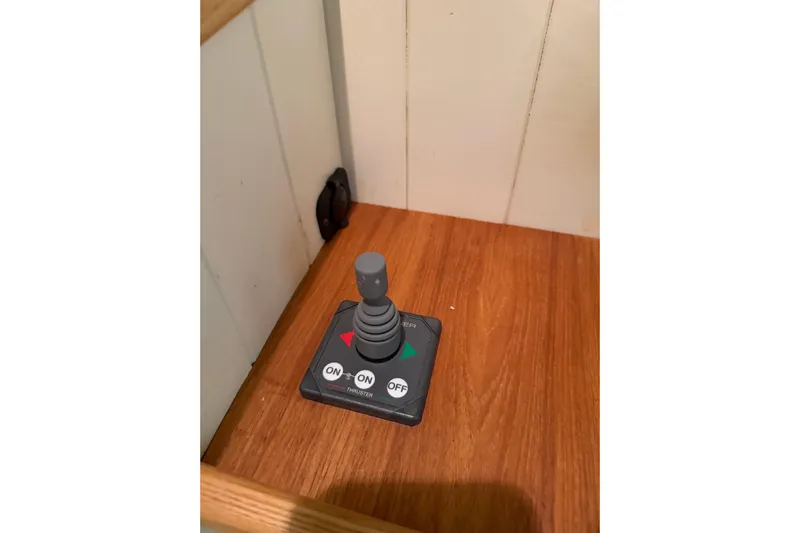 Chad-m Yacht Photos Pics Joystick control panel on 2022 Covey Island 38 Lobster Yacht, featuring on/off buttons.