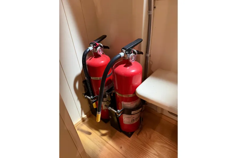 Chad-m Yacht Photos Pics Two red fire extinguishers on a Covey Island 38 Lobster Yacht, 2022 model.