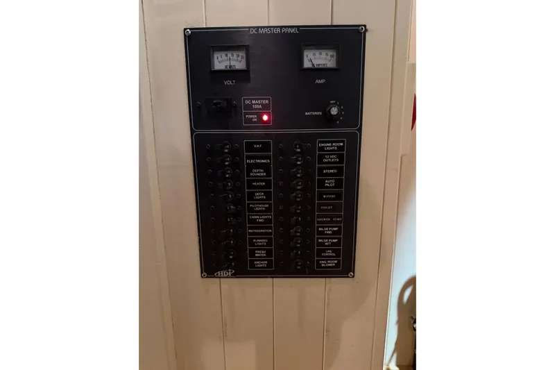 Chad-m Yacht Photos Pics Electrical panel on 2022 Covey Island 38 Lobster Yacht, featuring volt and amp meters.