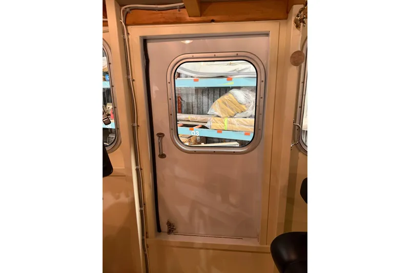 Chad-m Yacht Photos Pics Interior view of 2022 Covey Island 38 Lobster Yacht door with window.